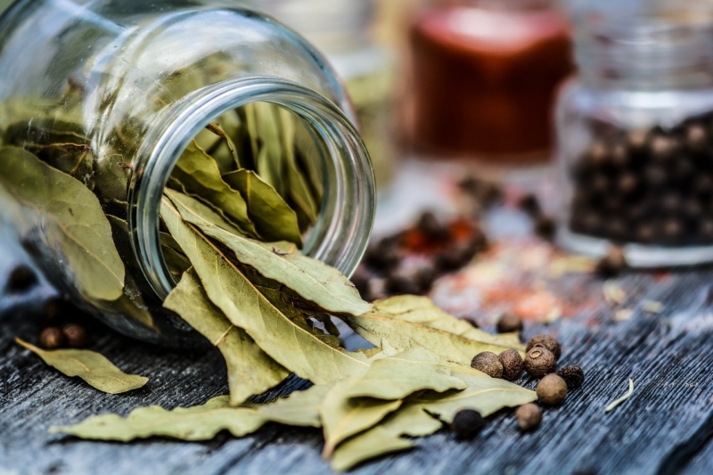 A Jar of dried spice leaves.