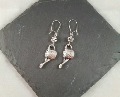 Silver watering can earrings.